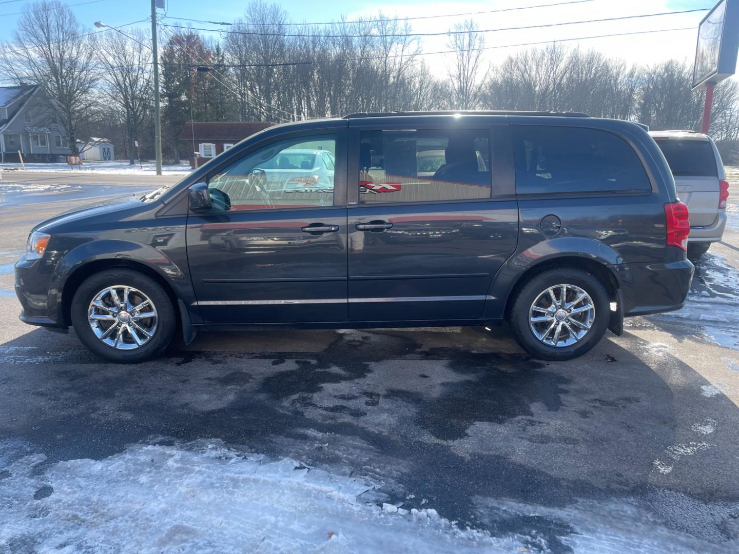 2014 Gray /Black Dodge Grand Caravan SXT (2C4RDGCG9ER) with an 3.6L V6 DOHC 24V FFV engine, 6 Speed Automatic transmission, located at 547 E. Main St., Orwell, OH, 44076, (440) 437-5893, 41.535435, -80.847855 - This 2014 Dodge Grand Caravan SXT is equipped with a rear entertainment system and STOW N GO seating, allowing for easy storage and flexibility. It also features a back-up camera, providing added convenience and safety when parking or reversing. With its versatile seating and entertainment options, - Photo#12